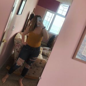 Yellow forever21 body suit w/clasps on the bottom